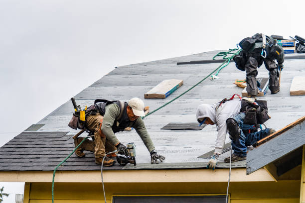 Professional Gutter Installation technician working in Victoria, KS